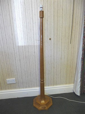 Lot 1816 - A Robert "Mouseman" Thompson Oak Standard Lamp, octagonal column and base, with carved mouse...