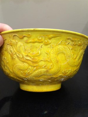 Lot 165 - A Chinese Yellow Glazed Porcelain Bowl, Hongzhi reign mark but not of the period, moulded with...