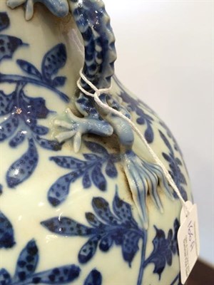 Lot 166 - A Chinese Porcelain Vase, 19th century, of baluster form with mythical beast handles, painted...