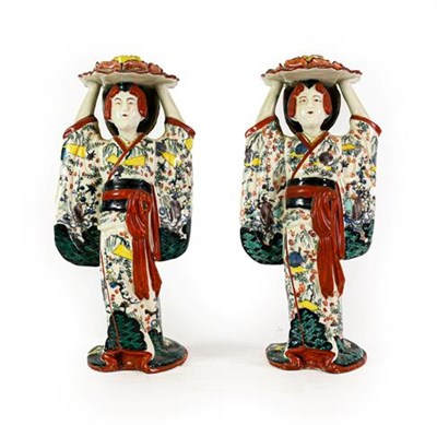 Lot 169 - A Pair of Japanese Porcelain Figural Candlesticks, Meiji period, modelled as maidens wearing...