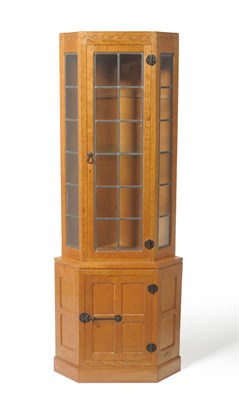 Lot 1818 - A Robert "Mouseman" Thompson Oak Corner Display Cupboard, penny moulded frieze/castellated, the...