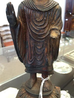 Lot 180 - A Chinese Bronze Figure of Buddha, 18th/19th century, standing wearing flowing robes, both...