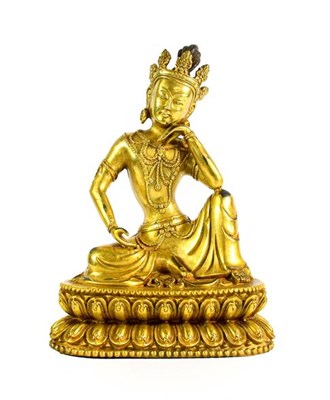 Lot 181 - A Sino-Tibetan Gilt Bronze Figure of a Bodhisattva, probably 17th/18th century, seated in...