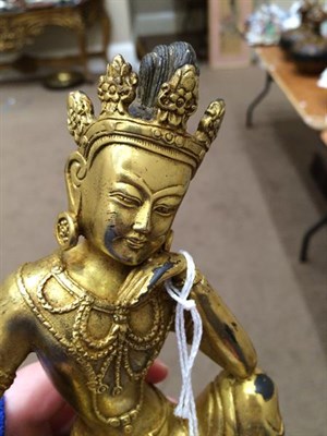 Lot 181 - A Sino-Tibetan Gilt Bronze Figure of a Bodhisattva, probably 17th/18th century, seated in...