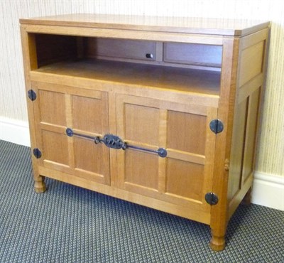 Lot 1819 - A Robert "Mouseman" Thompson Oak Music Cupboard/Cabinet, the rectangular top over an open...