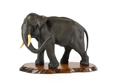 Lot 189 - A Japanese Bronze Model of an Elephant, Meiji period, naturalistically modelled standing with...