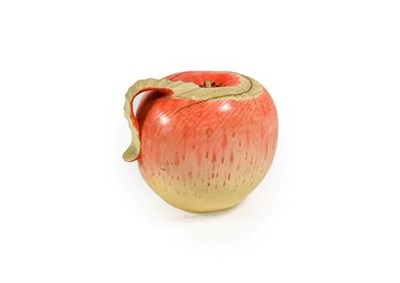 Lot 197 - A Japanese Ivory Fruit Okimono, Meiji/Taisho period, naturalistically carved and stained as an...