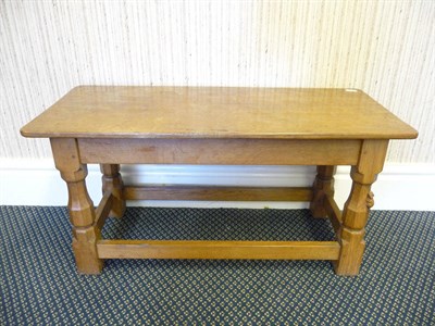 Lot 1821 - A Robert "Mouseman" Thompson Oak Rectangular Coffee Table, on four octagonal legs joined by...