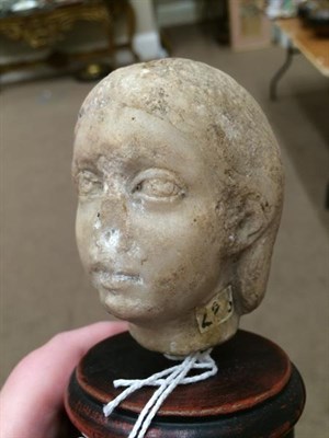 Lot 220 - A Carved Marble Head, possibly Roman, 1st century AD, 8cm high, on a later turned and stained...