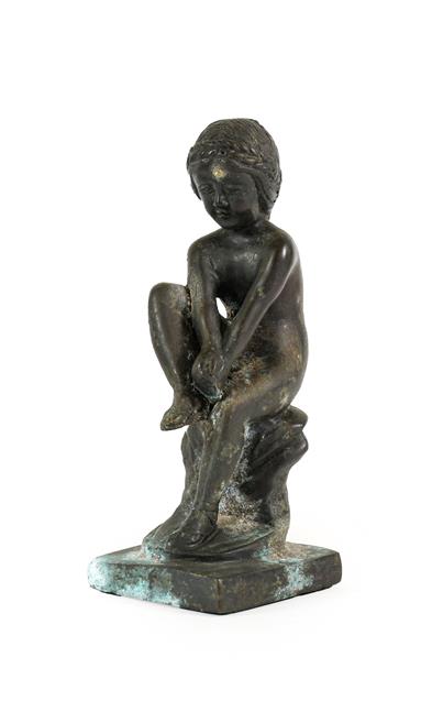 Lot 227 - After the Antique: A Bronze Figure of Spinario, sitting on a rocky outcrop and rectangular...