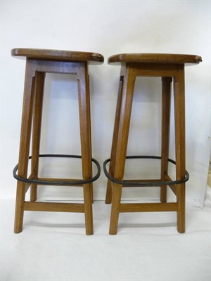 Lot 1824 - A Pair of Robert "Mouseman" Thompson Oak High Bar Stools, on four octagonal legs joined by a...