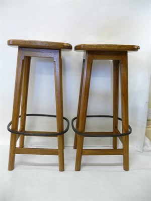 Lot 1825 - A Pair of Robert "Mouseman" Thompson Oak High Bar Stools, on four octagonal legs joined by a...