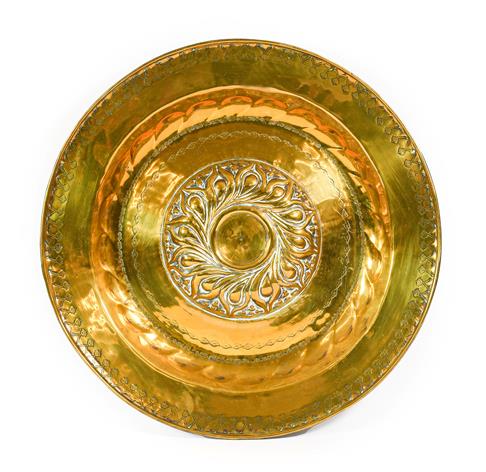 Lot 247 - A Nuremberg Brass Alms Dish, 17th century, the central gadrooned boss within foliate bands,...