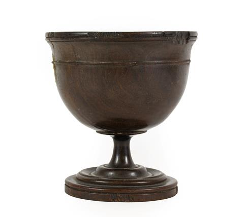 Lot 268 - A Lignum Vitae Pedestal Cup, 18th century, the ovoid bowl with reeded rim and turned band on a...