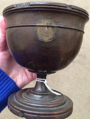 Lot 268 - A Lignum Vitae Pedestal Cup, 18th century, the ovoid bowl with reeded rim and turned band on a...