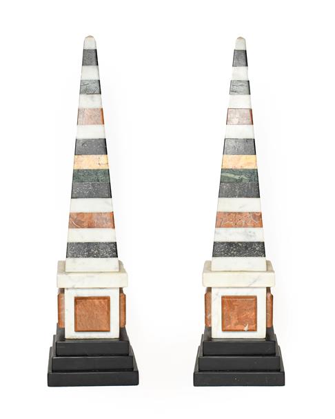Lot 270 - A Pair of Specimen Marble Obelisks, in George III style, on stepped square slate bases, 49cm high