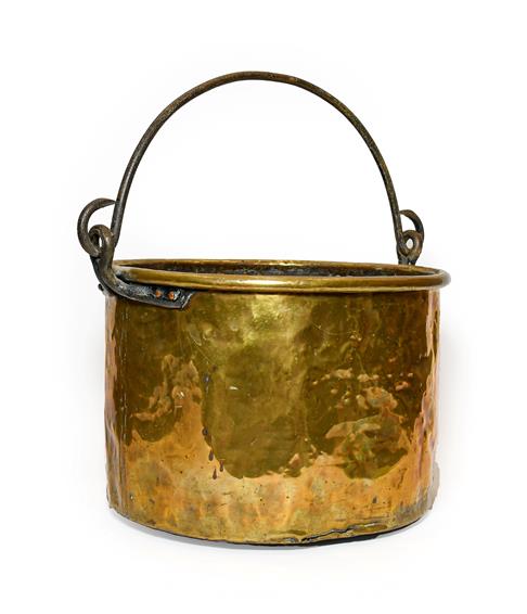 Lot 271 - A Brass Log Bin, possibly Irish, 18th/19th century, of circular form with rolled rim and iron swing