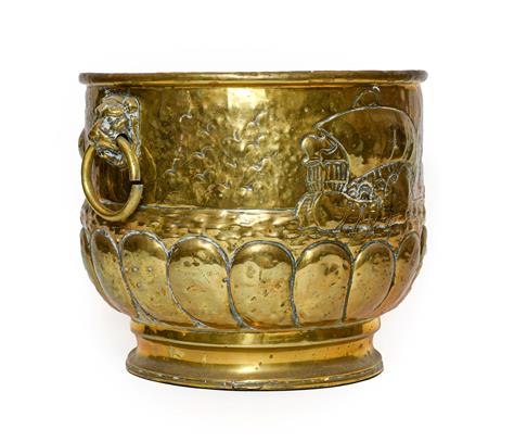 Lot 272 - A Dutch Brass Log Bin, late 19th/early 20th century, of cylindrical form with mask and ring handles