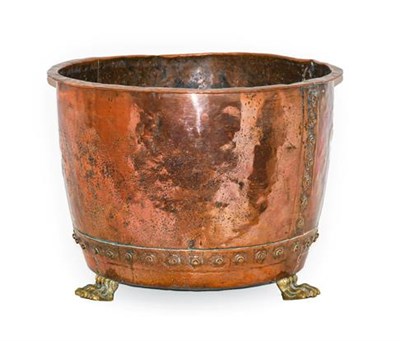 Lot 274 - A Brass and Copper Log Bin, 19th century, of circular form with everted rim, on paw feet, 54cm...