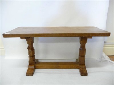 Lot 1829 - A Robert "Mouseman" Thompson Oak Rectangular Coffee Table, on two octagonal legs, joined by a...