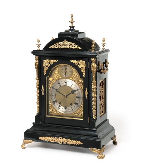 Lot 286 - A Victorian Ebonised and Gilt Metal Mounted Chiming Table Clock, circa 1890, arched pediment...