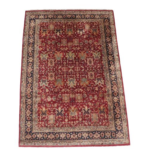 Lot 298 - Large Indian Carpet, modern The brick red field with an allover design of flowing vines and...