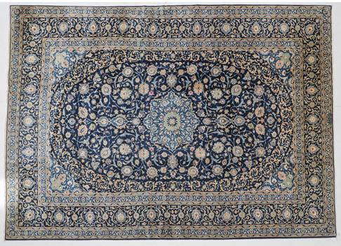 Lot 301 - Kashan Carpet Central Iran, circa 1970 The indigo field of palmette and vines around a...