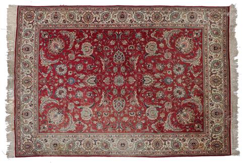 Lot 310 - Tabriz Carpet  North West Iran, circa 1950 The faded blood red field with an allover design of...