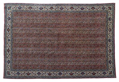 Lot 311 - Ghom Carpet Central Iran, circa 1930 The field comprised of narrow polychrome bands of tendrils and