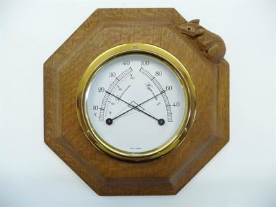 Lot 1832 - A Robert "Mouseman" Thompson Oak Octagonal Hygrometer/Thermometer, brass German mechanism, with...