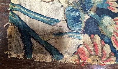 Lot 319 - A Flemish ''Tapestry'' Fragment, probably 17th century, worked in silk and wool depicting a...