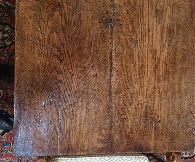 Lot 324 - An Oak Refectory Table, early 18th century, the rectangular top of four plank construction...