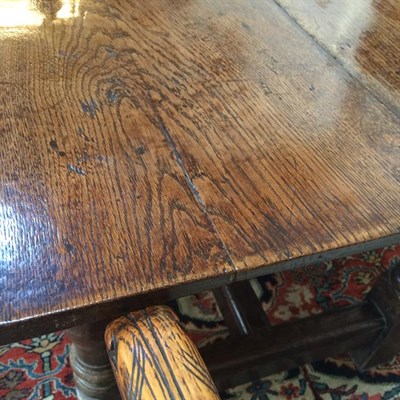 Lot 324 - An Oak Refectory Table, early 18th century, the rectangular top of four plank construction...