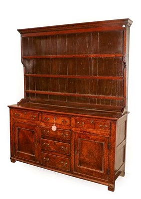 Lot 328 - A George III Oak Enclosed Dresser and Rack, late 18th century, the upper section with three...