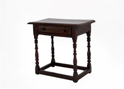 Lot 333 - A 17th Century Oak Side Table, with moulded top and single moulded drawer, on turned spindle...