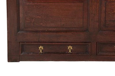 Lot 336 - A Joined Oak Clothes Press, circa 1700, with moulded panels and a central cupboard door...