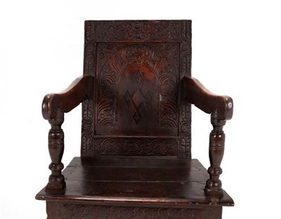 Lot 337 - A 17th Century Joined Oak and Carved Wainscot Armchair, bearing Journeyman stamp RS, the back...