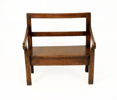 Lot 343 - A Late George III Child's Oak Settle, early 19th century, with rail back, downswept arms and...