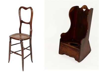 Lot 347 - A Victorian Stained Pine Child's Rocking/Commode Chair, mid 19th century, with heart shaped pierced