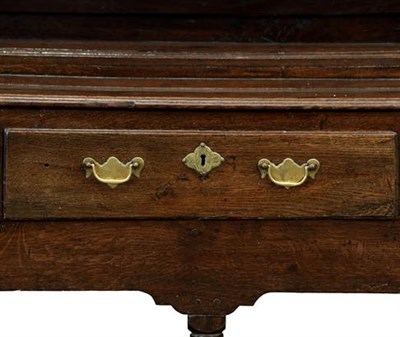 Lot 348 - A George III Oak Open Dresser and Rack, 3rd quarter 18th century, the bold cornice above a wavy...