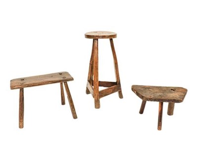 Lot 350 - Three Primitive Stools, comprising an early 19th century oak rectangular example of peg...