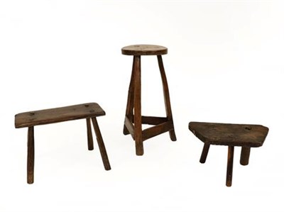 Lot 350 - Three Primitive Stools, comprising an early 19th century oak rectangular example of peg...