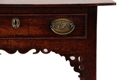 Lot 356 - A George II Oak and Mahogany Crossbanded Side Table, the moulded top above a single frieze...