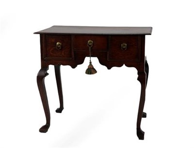 Lot 360 - A George II Oak Dressing Table, 2nd quarter 18th century, the moulded top above three small drawers
