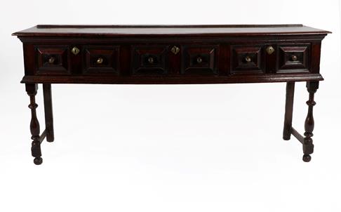 Lot 363 - A Late 17th Century Oak Geometric Moulded Dresser Base, the moulded top above three two-as-one...