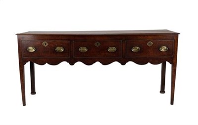 Lot 368 - A George II Oak and Mahogany Crossbanded Low Dresser, mid 18th century, the moulded top above three