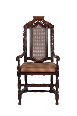 Lot 369 - An 18th Century Joined Oak Caned Chair, the moulded top rail above spindle turned wings with...