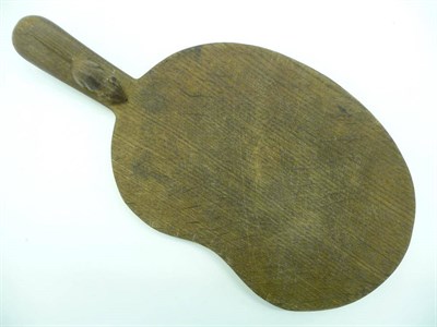 Lot 1837 - A Robert "Mouseman" Thompson Oak Cheese Board, with kidney shaped board and carved mouse...