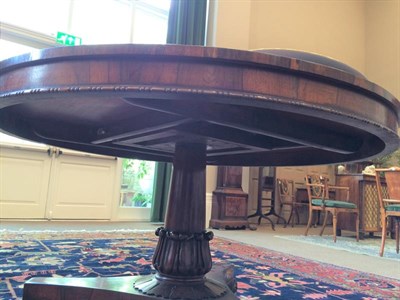Lot 382 - An Early Victorian Rosewood Circular Tilt-Top Dining Table, mid 19th century, the plain frieze...