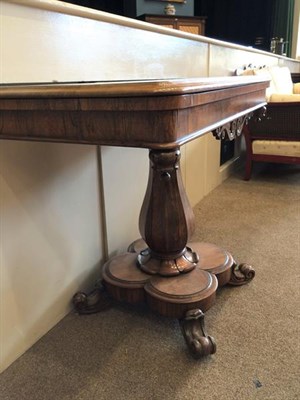 Lot 389 - A Victorian Rosewood Foldover Tea Table, mid 19th century, the moulded frieze above a scrolled...